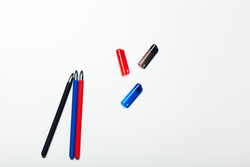 different colors pens isolated on the white background