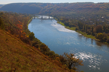 Railway bridge above Dnister River in the Zalishchyky town. Autumn landscape. Ternopil region, Ukraine