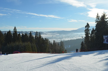 Fototapeta premium Snowy ski slope in Poland under the sun