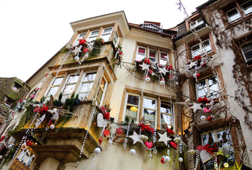 Christmas decoration with white bears, red hearts, stars, and snowflakes in medieval city of Strasbourg (France) which is considered as a Capital of Christmas.