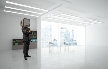 Businessman with an old TV instead of head.