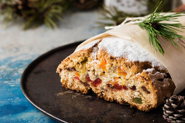 Traditional Christmas stollen with dried fruit and candied fruits