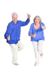 Portrait of senior couple with thumbs up