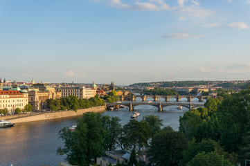 Fototapeta na wymiar Panoramic view of Vltava river with Charles bridge and historic towers