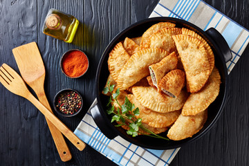 deep fried turnovers or chebureki, flatlay