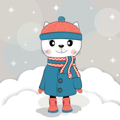 Cute winter cat in a coat with hat and scarf.