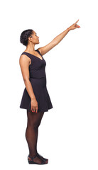 Side view of a black African-American woman in a brown dress pointing upwards.