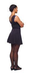 Side view of black woman in a brown dress.