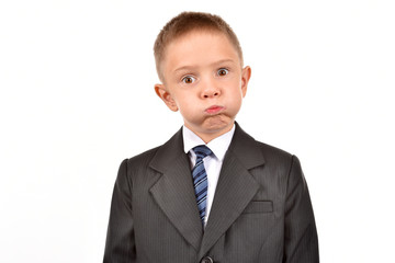 Boy in a suit on a white background. Bad guy.