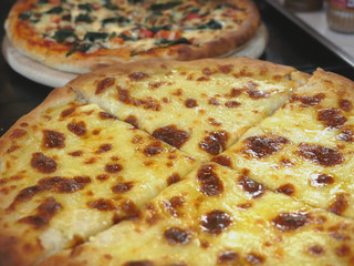 Close up of pizza Margarita with Tomatoes and Mozzarella Cheese