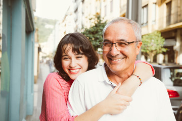 Portrait of happy father and daughter embracing on the street - Powered by Adobe