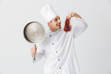 Cheerful chef cook wearing uniform