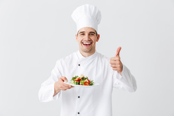 Excited man chef cook wearing uniform