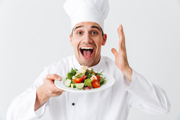 Excited man chef cook wearing uniform