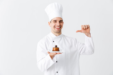 Cheerful man chef cook wearing uniform