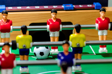 Toy soccer with a ball on the field