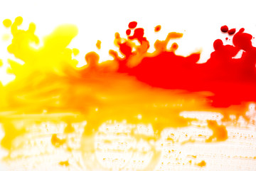 a spot of red paint on a white background.