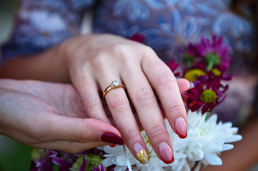 Obraz na płótnie Canvas hands with wedding rings
