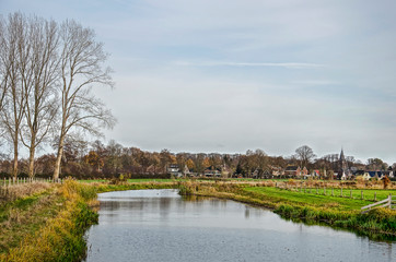 Obraz premium View of the river Berkel with the village of Almen, The Netherlands in the background