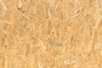 pressed wooden panel background, seamless texture of oriented strand board - OSB wood