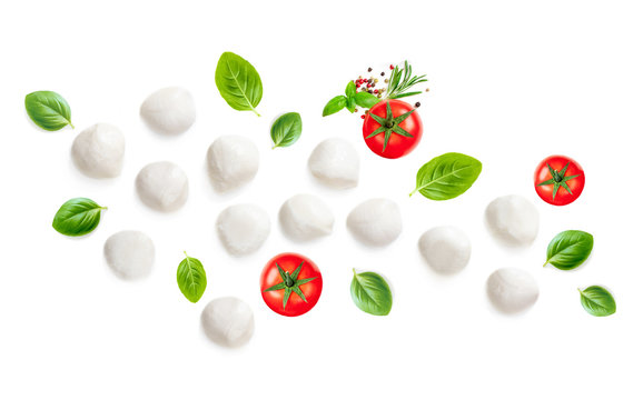 Mozarella, Basil leaf and  Tomatoes  isolated on white Background. Creative layout made of Food Ingredients for caprese salad.  Top view. Flat lay