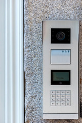 Video intercom with number keyboard in the entry of building