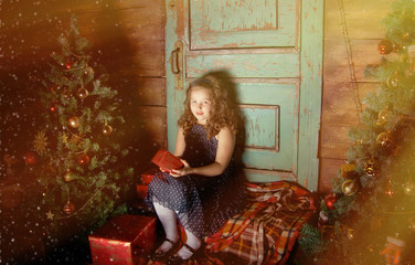 Happy little girl  decorate Christmas tree