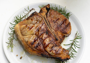 Florentine steak on the white dish
