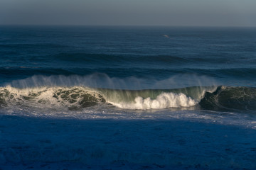 Atlantic ocean waves at Portugal coast next to Nazare city.