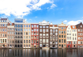 Fototapeta premium building of apartment along river or canal for tourist, tour, cruise or ship transportation in Amsterdam in Netherlands Europe