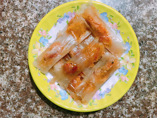 Banh bot loc cake, glutinous rice cake with shrimp chilly pork wrapped in banana leaf Vietnamese cuisine street food 