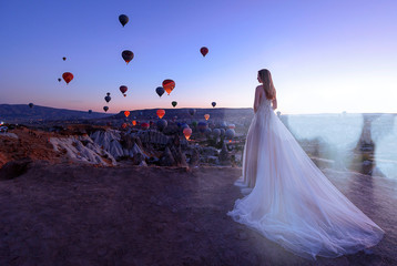 Wedding in Cappadocia G?reme with a young married couple on the background of balloons.