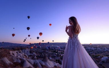 Wedding in Cappadocia G?reme with a young married couple on the background of balloons.