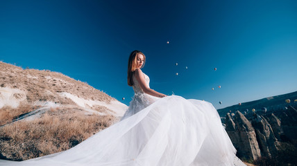 Wedding in Cappadocia G?reme with a young married couple on the background of balloons.