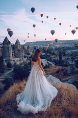 Wedding in Cappadocia G?reme with a young married couple on the background of balloons.