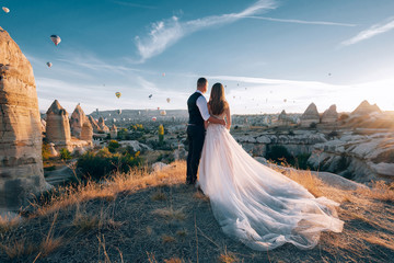 Wedding in Cappadocia G?reme with a young married couple on the background of balloons.
