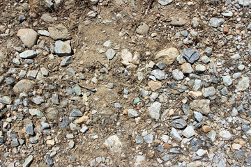Gravel dirt road stones close up horizontal