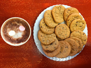 Baking chocolate chips biscuits on a plate homemade sweet cookies 
