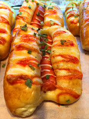 Delicious bread with pork floss and sausage American hot dog with mustard tomato sauce homemade baking bread