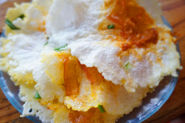 Banh trang nuong - Vietnamese street food with grilled rice paper egg onion small shrimp pork floss 