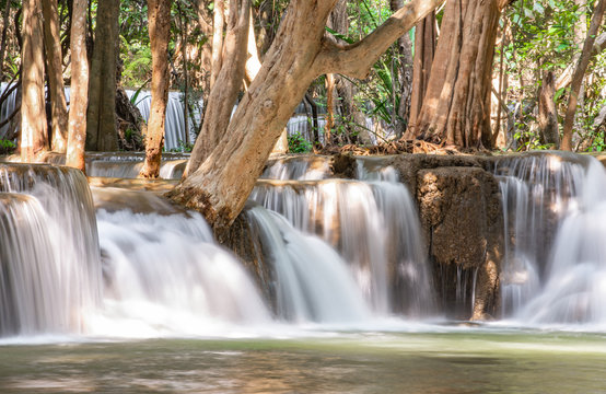 Waterfall flowing from the mountains at Huay Mae khamin waterfall National Park ,Kanchana buri in Thailand. © Nueng