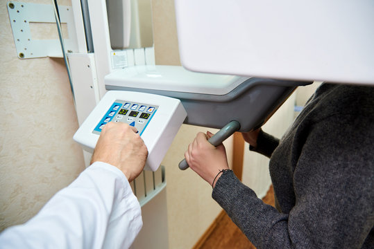 doctor's hands on the control panel. Computer diagnostics. dental tomography