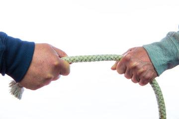 Two people pull on a rope