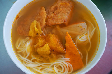  Bun Cha Ca - Delicious grilled catfish fish caked noodles Da Nang signature dish Vietnamese food Asian cuisine with red green chilly herb tomato onion lettuce spinach tomato pork stock 