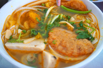  Bun Cha Ca - Delicious grilled catfish fish caked noodles Da Nang signature dish Vietnamese food Asian cuisine with red green chilly herb tomato onion lettuce spinach tomato pork stock 