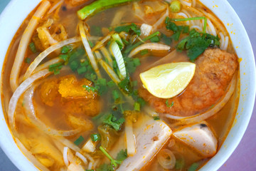  Bun Cha Ca - Delicious grilled catfish fish caked noodles Da Nang signature dish Vietnamese food Asian cuisine with red green chilly herb tomato onion lettuce spinach tomato pork stock 
