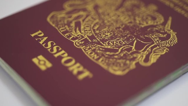 UK Passport HD Footage against a white background with a sliding camera move 