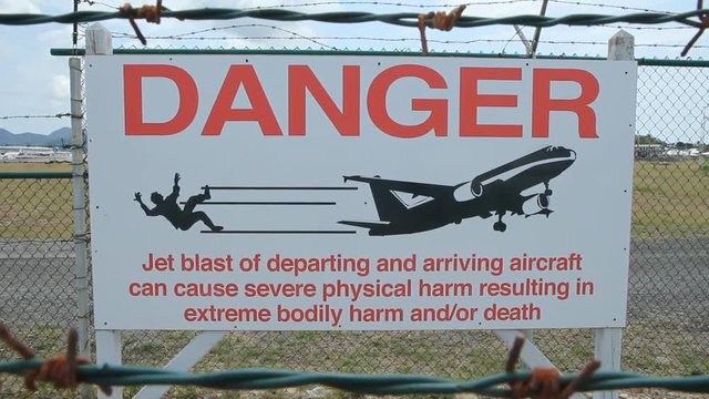 ST MAARTEN on APRIL 17th: Sign warning of jet blast at Princess Juliana airport, St Maarten. The airport is known for its low altitude plane approaches which come over Maho beach.