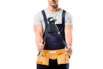 cropped view of woker holding pipe wrench isolated on white