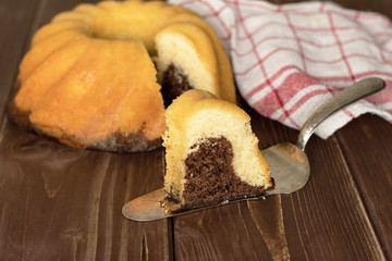 Group of one whole one slice of fresh baked marble gugelhupf sweet bread variety with a tea towel...